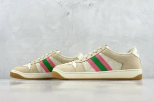 Gucci Screener Series GG Enamel used sneakers with pink and green stripes, displayed on a neutral background.
