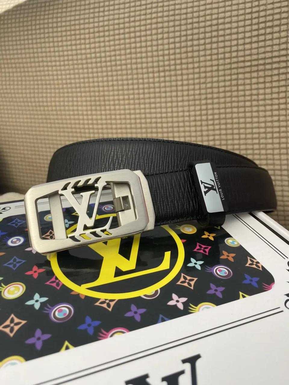 Louis Vuitton belt black leather silver metal LV logo buckle luxury accessory