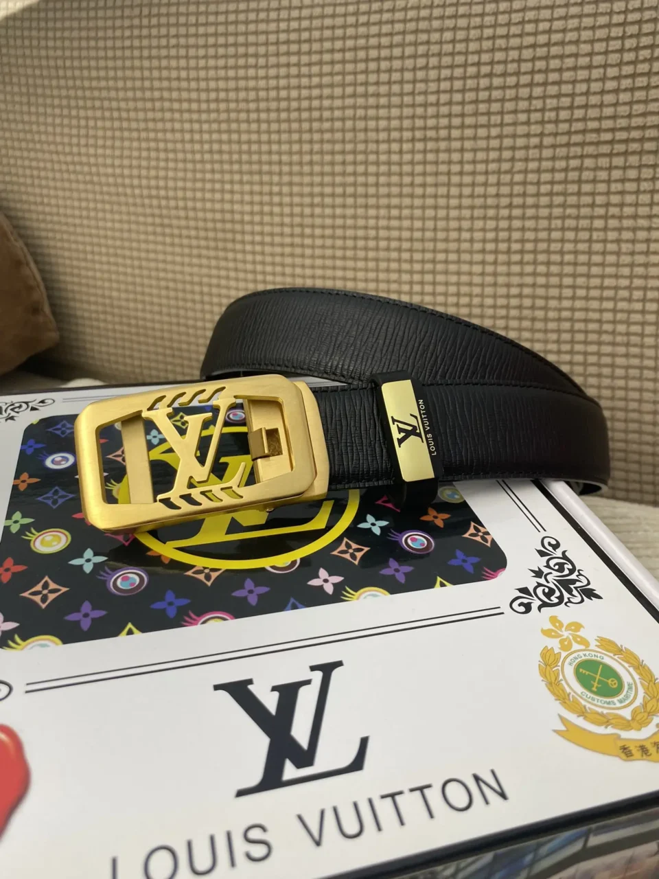 Louis Vuitton belt black leather with gold LV buckle and logo plaque accessory