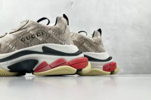 Gucci x Balenciaga Parisian Family Triple S Brown sneakers with signature logo detailing and distinctive multicolored sole, showcasing a stylish design for sneaker enthusiasts.