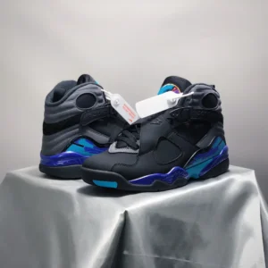 Nike Air Jordan 8 Retro black blue turquoise leather sneakers with velcro straps and multicolor accents