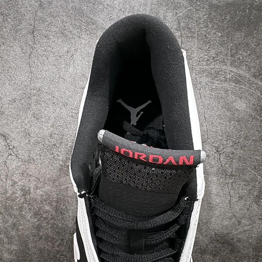 Nike Air Jordan 1 High OG black white red leather sneakers with Jumpman logo on the insole