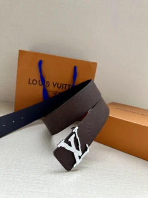 4.0-wide LV Shadow belt with Monogram displayed alongside Louis Vuitton packaging, showcasing the double-layered LV buckle and premium leather design.