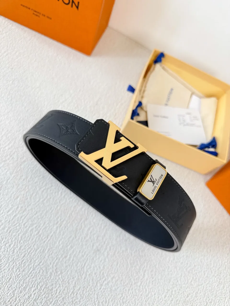 Louis Vuitton belt black leather with gold LV buckle and engraved logo plate accessory