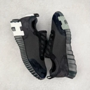 Hermes Men’s Bouncing Sneaker in black technical mesh with textured outsole and contrasting white accents, showcasing luxury footwear design for casual wear.