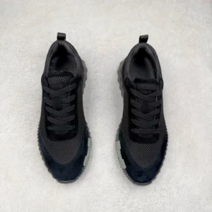Hermes Men’s Bouncing Sneakers in technical mesh, black color, featuring a modern design and textured outsole, suitable for luxury casual wear.