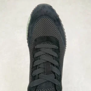 Hermes Men’s Bouncing Sneaker in black technical mesh with laces, showcasing premium design and craftsmanship.
