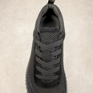 Hermes Men’s Bouncing Sneaker in black technical mesh with lace-up design and textured outsole, highlighting luxury footwear details for replica shoe buyers.