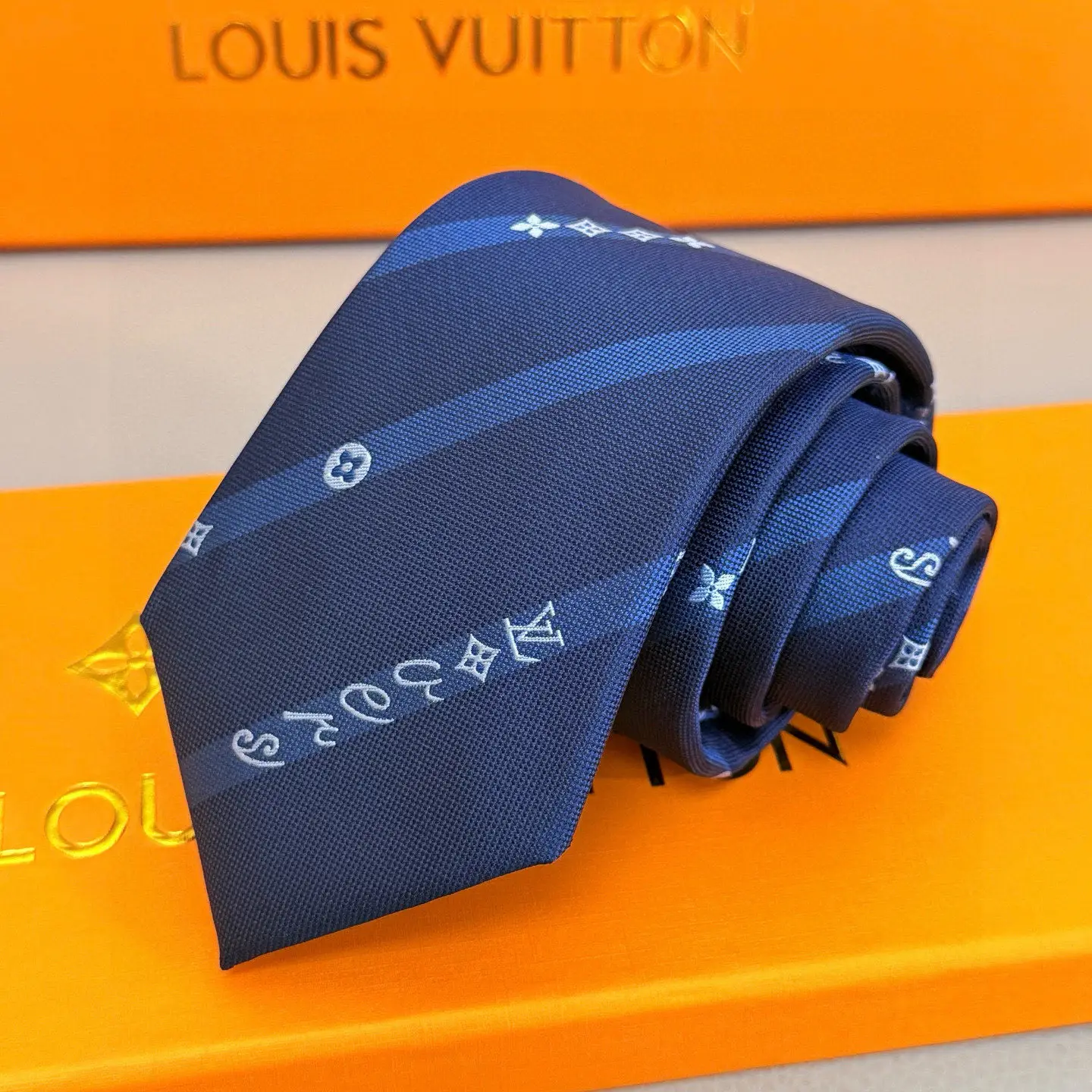 Louis Vuitton silk tie navy blue stripe monogram pattern luxury accessory