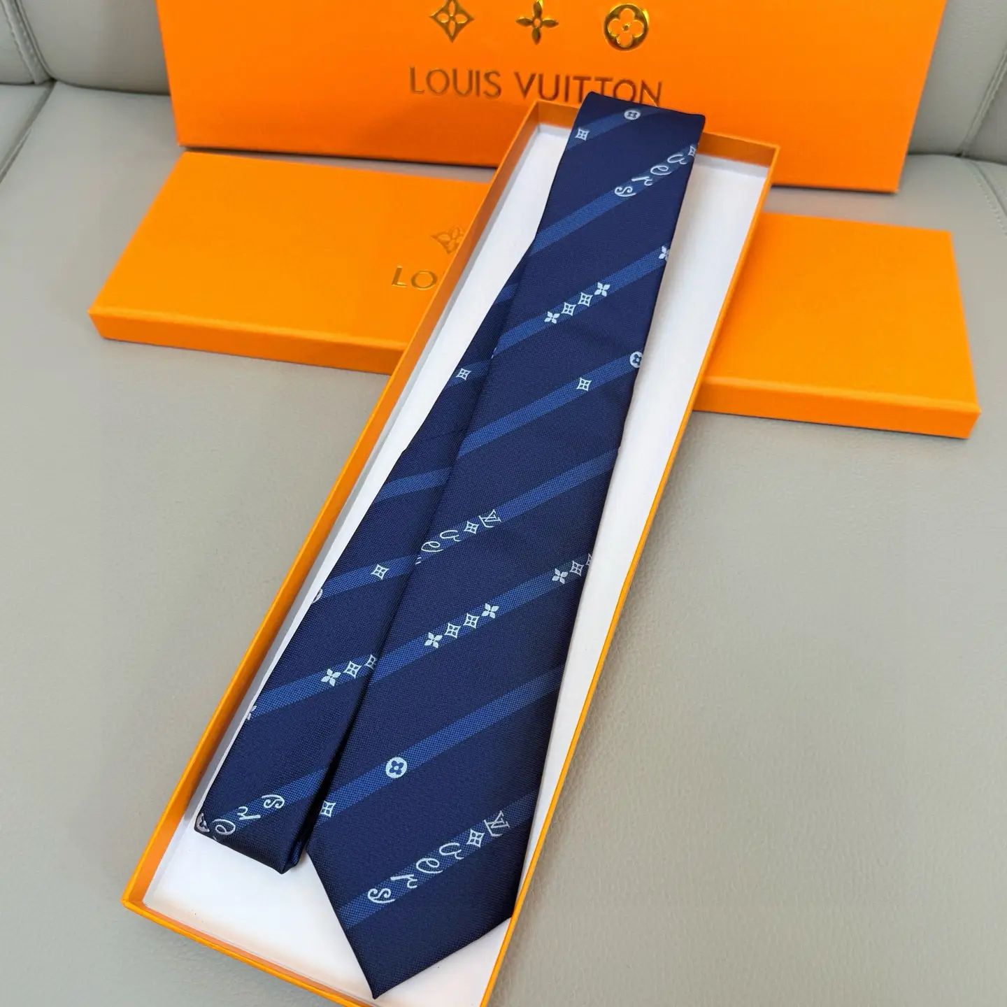 Louis Vuitton tie navy blue silk with monogram stripe pattern accessory in orange box packaging