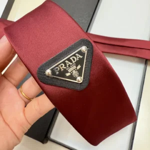 Prada headband burgundy nylon fabric with black and silver triangle logo emblem accessory