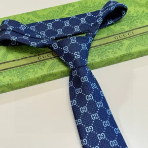 Gucci tie navy blue GG pattern silk accessory with branded green box packaging