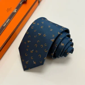 Hermès tie navy blue silk with orange horseshoe and whip pattern accessory