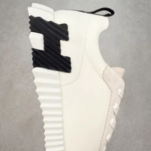 Hermes Men’s Bouncing Sneaker in technical mesh featuring a unique design with a textured outsole, showcasing luxury craftsmanship and style.