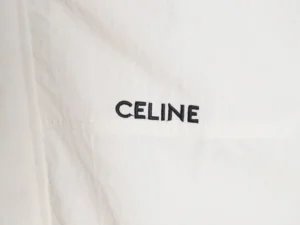 Celine logo embroidered on a white fabric, highlighting the brand's premium craftsmanship and authenticity in fashion.