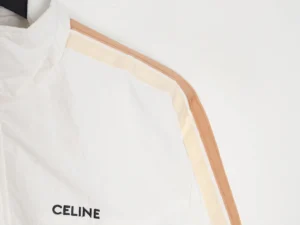Celine side woven zipper jacket featuring a white fabric with contrasting stripes and logo detail.