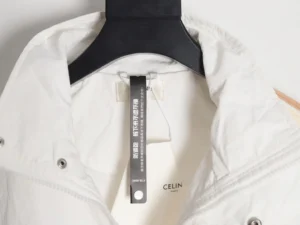 Celine jacket collar featuring brand label and hangtag, showcasing premium craftsmanship and design details.