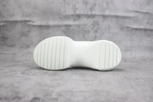 Louis Vuitton Archlight sneaker white rubber sole with embossed LV logo and ridged tread pattern