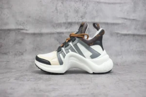 Louis Vuitton Archlight sneakers featuring a leather and mesh design, color-blocked accents, and a retro dad sneaker silhouette, presented on a textured gray background.