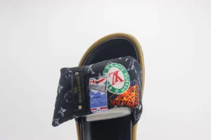 Louis Vuitton Velcro slide sandal featuring floral fabric and thick sole, showcasing decorative patches and logos, designed for couples, priced at $89.