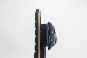 Louis Vuitton Velcro slide sandal featuring a thick sole and floral design, showcased in a side view.