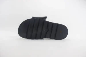 Black Velcro slide sandal with thick sole, showcasing bottom view, featured as part of Louis Vuitton's latest footwear collection for Spring/Summer 2024.
