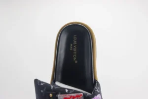 Louis Vuitton Velcro slide slipper showcasing the brand logo and floral fabric design, emphasizing luxury footwear for couples.