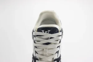 Louis Vuitton Trainer Low Cut sneaker featuring white laces, prominent logo on the tongue, and a stylish design, showcasing luxury footwear details for replica product listing.