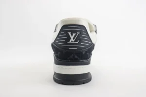 Louis Vuitton Trainer Low Cut sneaker rear view showcasing logo and design details, emphasizing luxury footwear features.