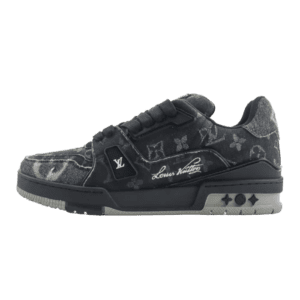 Louis Vuitton Trainer low-cut sneaker in black with signature monogram pattern, featuring a textured upper and branded details, showcasing luxury footwear design.
