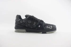 Louis Vuitton Trainer low-cut sneakers in black with signature monogram pattern, showcasing luxury design and craftsmanship.