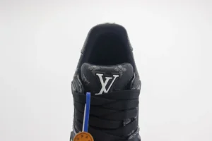 Louis Vuitton Trainer low-cut sneaker featuring iconic LV logo, black design, and blue tag, representing luxury footwear replica.