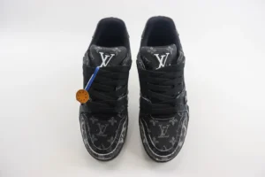 Louis Vuitton Trainer low-cut sneakers in black with signature logo, featuring a stylish design and detailed craftsmanship, ideal for luxury footwear enthusiasts.