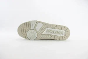 Bottom view of Louis Vuitton Trainer sneaker showcasing detailed tread design and logo, emphasizing luxury footwear craftsmanship and style.