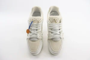Louis Vuitton Trainer low cut casual board shoes in white, featuring prominent logo, detailed craftsmanship, and stylish design, ideal for luxury footwear enthusiasts.