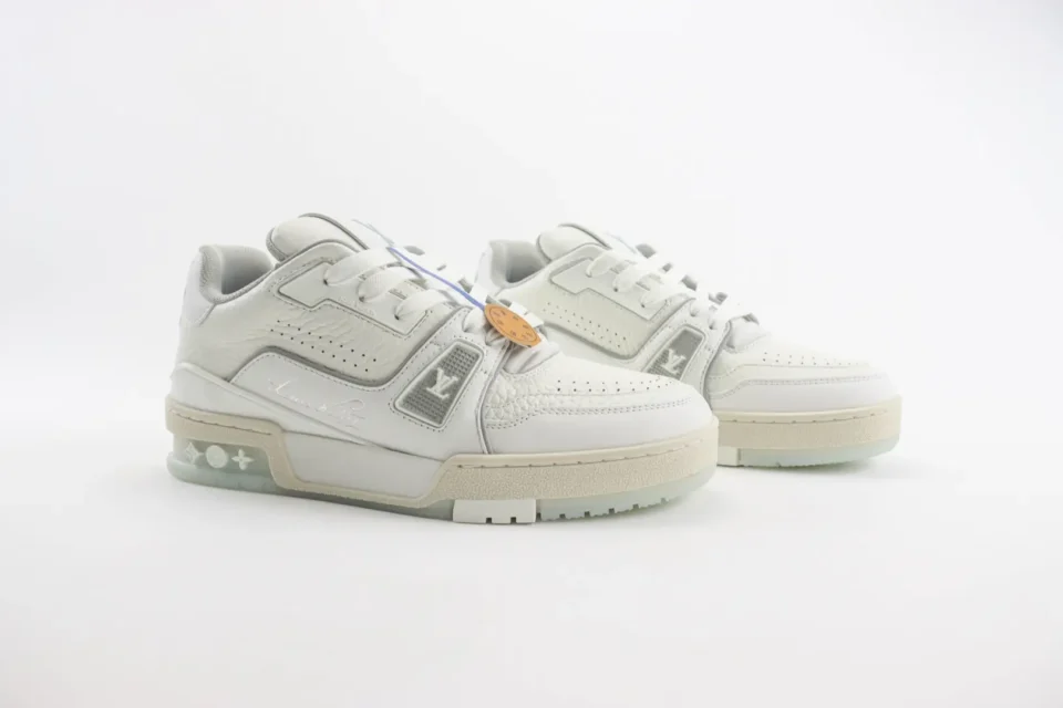 Louis Vuitton Trainer Low Sneaker white colorway leather material with signature LV logos and textured details