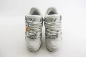 Louis Vuitton LV Trainer Sneaker white leather with rubber sole and LV metal lace charm