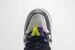 Nike Air Force 1 Low A1 style white black leather sneaker with black laces and yellow purple lace charm