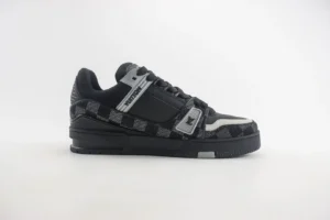Louis Vuitton Trainer low-top sneakers featuring a black and gray checkerboard pattern, sleek design, and branded detailing, ideal for luxury footwear enthusiasts.