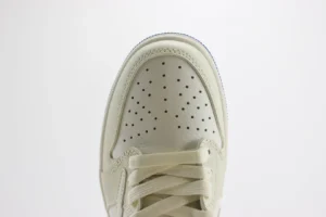 Nike Air Jordan 1 Low OG Sail off-white leather sneakers with perforated toe box and matching laces