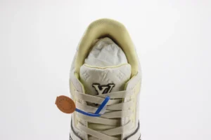 Louis Vuitton LV Trainer sneaker beige leather monogram embossed lace-up sneakers