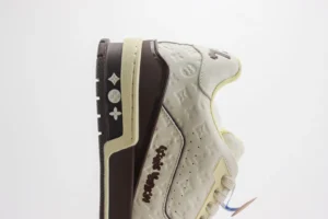 Louis Vuitton LV Trainer 1A8YQA cream brown leather embossed sneakers with monogram detail