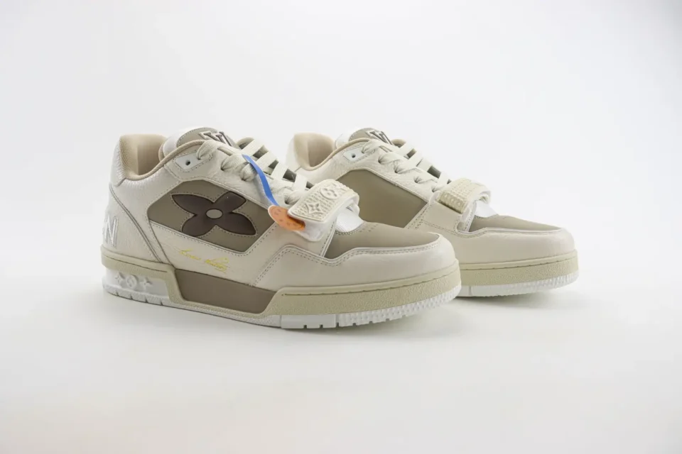 Louis Vuitton Trainer Sneaker beige brown leather low top with signature floral logo and strap detail