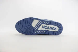 Bottom view of Tyler x Louis Vuitton Trainer sneakers showcasing blue rubber outsole and prominent "VUITTON" logo, emphasizing luxury sneaker design and craftsmanship.