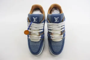 Tyler x Louis Vuitton Trainer sneakers featuring a blue and tan colorway, prominent Louis Vuitton logo, and detailed craftsmanship, showcased for purchase on RepsGoat.