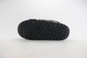 Louis Vuitton Trainer sneaker sole featuring textured rubber design and logo, highlighting luxury footwear details.