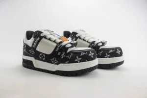 Louis Vuitton Trainer sneakers featuring a black and white design with iconic logo patterns, showcasing premium materials and craftsmanship, available for purchase at $179.00.