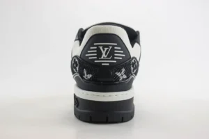 Louis Vuitton Trainer sneaker featuring distinctive black and white design, logo detail on the heel, emphasizing luxury and high-quality craftsmanship.