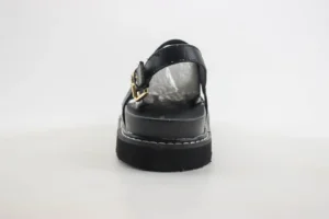 Unknown brand black sandals with adjustable buckle strap and thick flat sole made of synthetic material