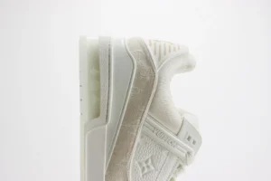 Louis Vuitton Trainer sneakers in white, showcasing luxury design and craftsmanship, highlighted for premium fashion appeal.